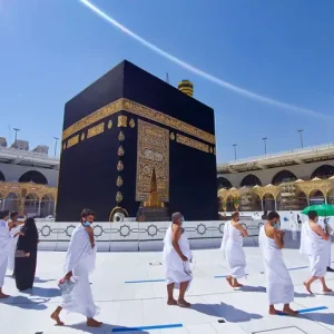 Kaaba with Hajr‑e‑Aswad in the eastern corner and front door during hajj and umrah Tawaf